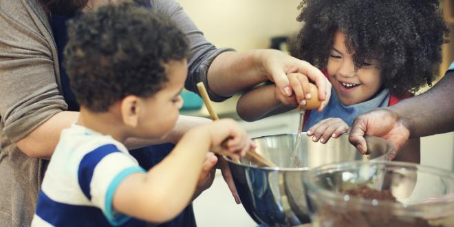 Kids helping to make cookies.