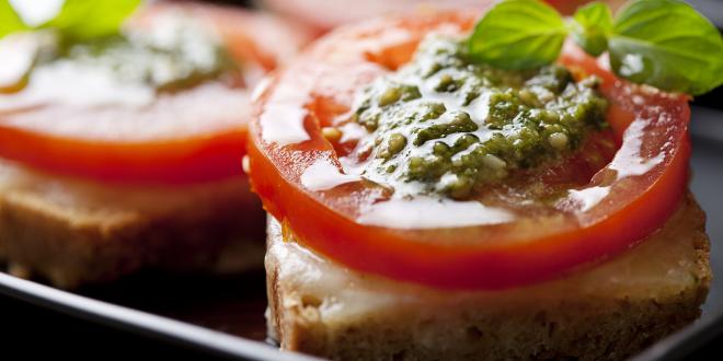 pesto bruschetta finger-food on a platter