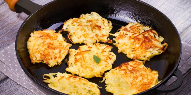 Sweet potato Latkes in frying pan.