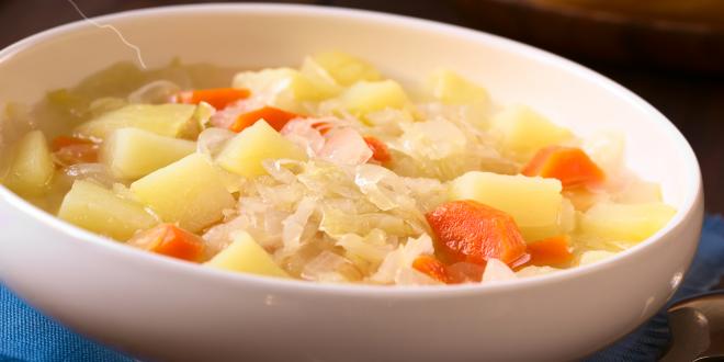 A bowl of vegetarian irish stew with cabbage and potatoes