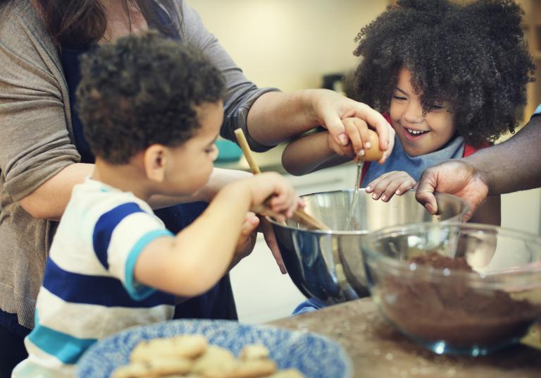 Kids helping to make cookies.